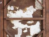 a picture of an old window with peeling paint on it