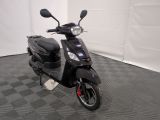 an image of a scooter parked in a garage