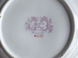 a white plate with a pink design on it