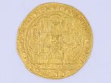 l'image d'une pièce d'or sur laquelle figure l'image d'un homme