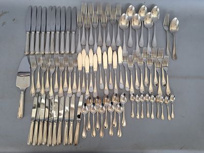a lot of forks and spoons on the table