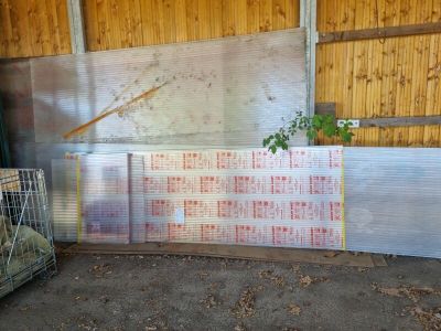 a large pile of plastic sheets in a building