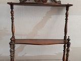 a wooden shelf with a shelf on top of it