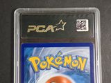 a close up of a pokemon card on a table