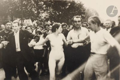 a black and white photo of a group of people dancing