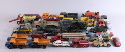 many different types of toy trucks and trucks on a white surface