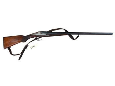 a shotgun with a wooden barrel and a black handle