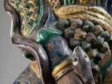 an image of a statue of a man with a bird on his shoulder
