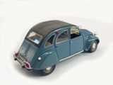 a toy car that is sitting on a white surface