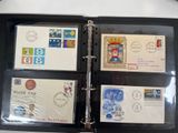 a black binder with four different stamps on it