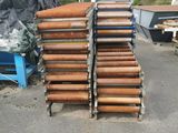 a lot of wooden pipes stacked on top of each other