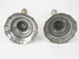 pair of silver metal candlesticks on a white background