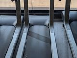 three treads in a row in a gym room