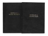 a black book with gold lettering on it and a black cover