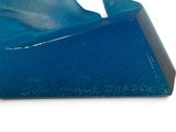 a blue plastic object that is shaped like a whale