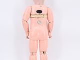 a pink toy that is standing in front of a white background