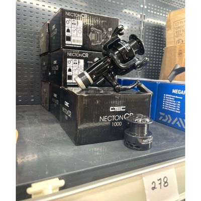 a black camera sitting on top of a box in a store