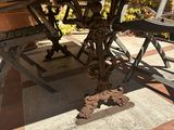 a table with a bench underneath it on a patio