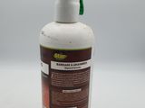 an image of a bottle of hand sanitizer on a white surface