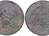 a close up of a coin with a man on it