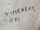 a sign that says winereux frisbee on the ground
