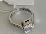 a silver ring with a diamond padlock attached to it