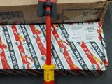 a red and yellow screwdriver sitting on top of a pile of boxes