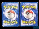 two cards with a pokemon figure on them on a black background
