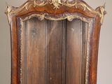 an old wooden cabinet with a mirror on top of it