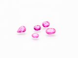 a group of pink sapphires on a white background