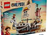 Le bateau pirate Lego se trouve dans la boîte posée sur la plage.