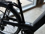 a bicycle that is parked in front of a window
