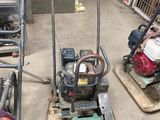two machines that are sitting in a garage