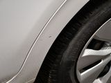 a close up view of a car ' s tire with a sticker on it