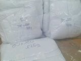 several bags of toilet paper sitting on top of a wooden box
