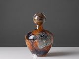 a small glass bottle that is sitting on a table