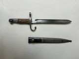 two different types of knives are displayed on a white surface