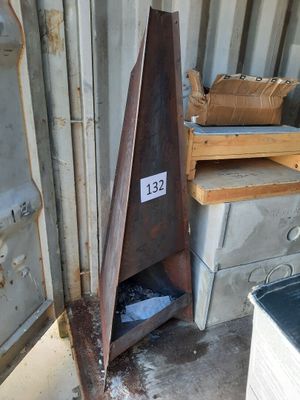 a metal object that is sitting in the corner of a building
