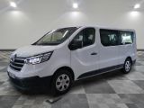 the white van is parked on a checkered tile floor
