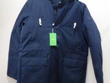 the jacket is blue and has a green tag on it