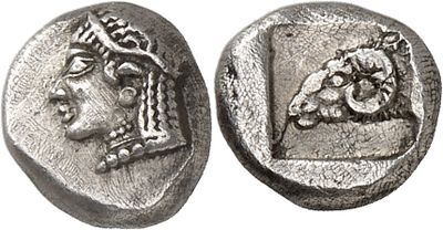 a silver coin with an image of a woman on it