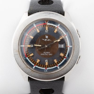 an image of a close up of a wrist watch on a white surface