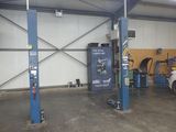 a picture of a garage with a car in it