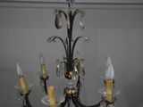 a chandelier hanging from the ceiling in a room