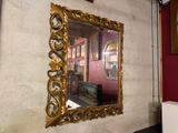 a mirror hanging on the wall in a room