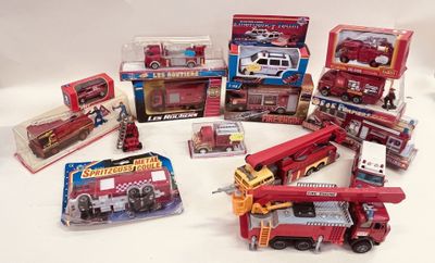 a lot of toy fire trucks that are on the table