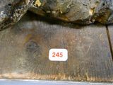 a picture of a piece of wood with a sticker on it