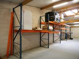a room with a lot of shelves and a tv on it