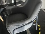 a chair that is sitting in the middle of a room
