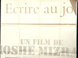 a poster on the wall of a building advertising a movie